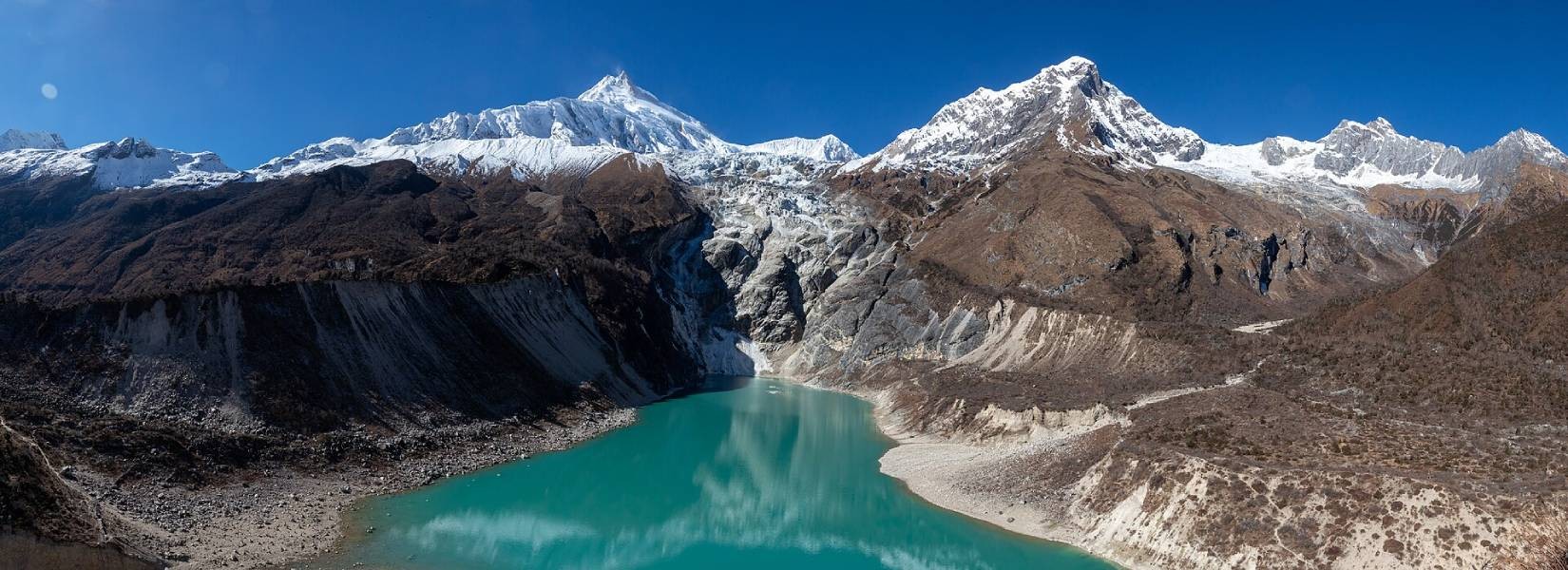 Trekking through the remote Serang Gompa trail in the Manaslu region, Nepal.