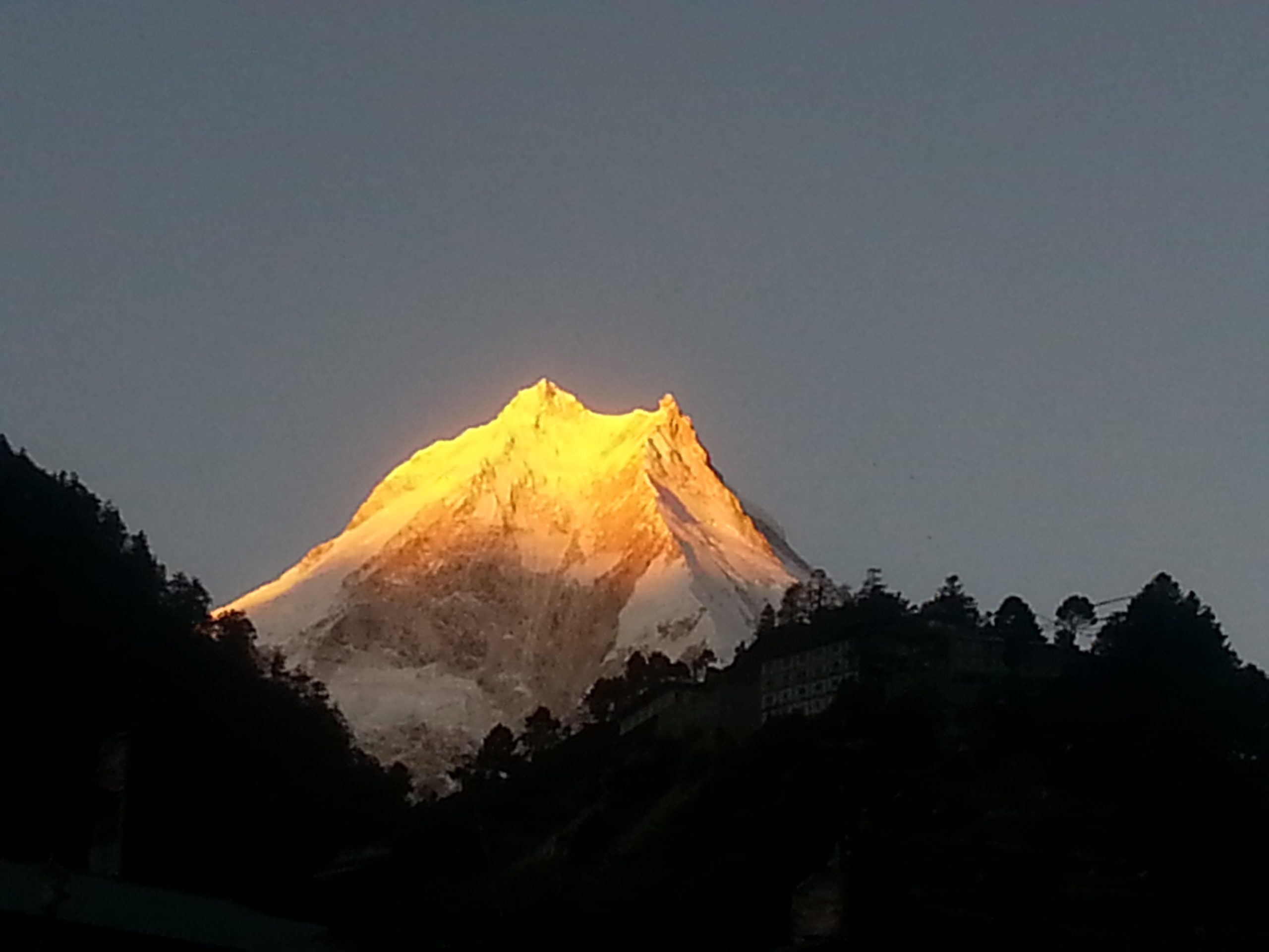 Trekking in valleys and villages with Himalyan peaks on the Lower Manaslu Circuit Trek.
