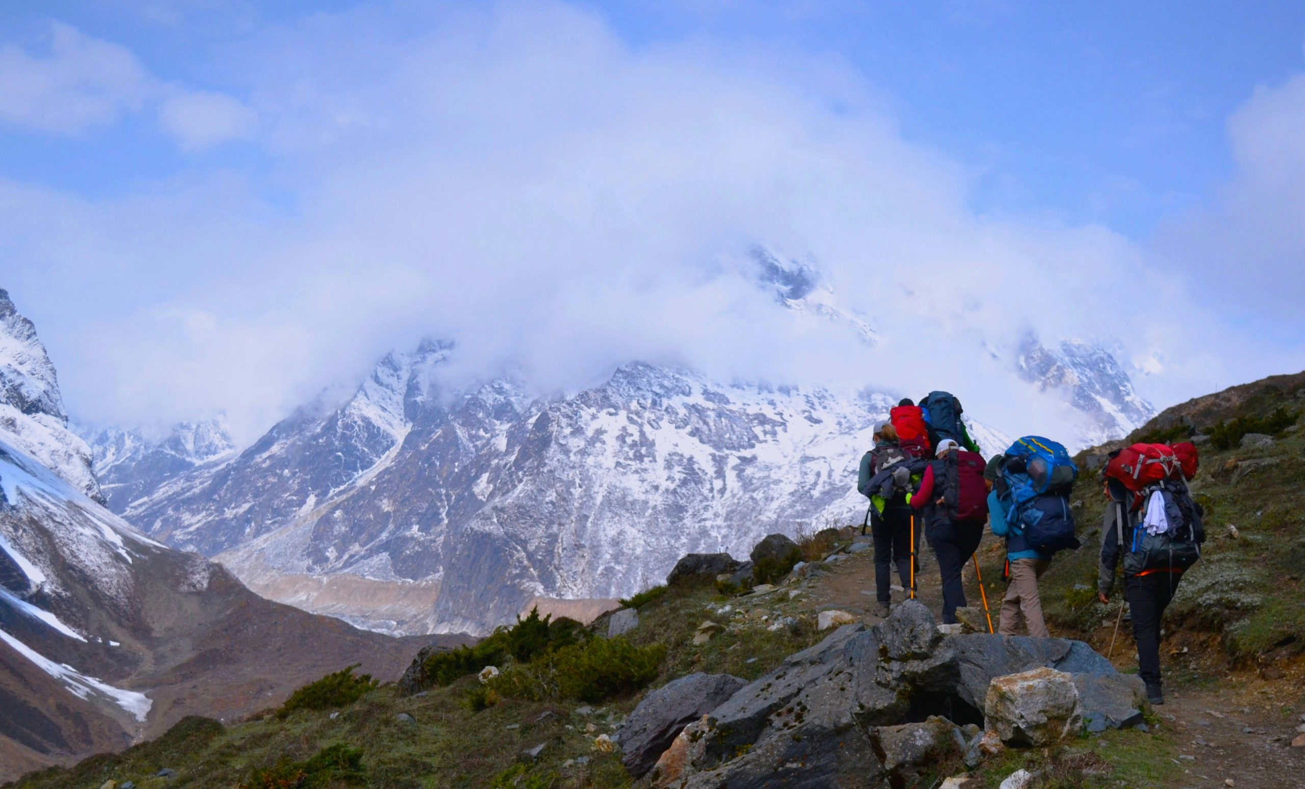 Trekkers on the Short Manaslu Circuit Trek with Himalayan peaks